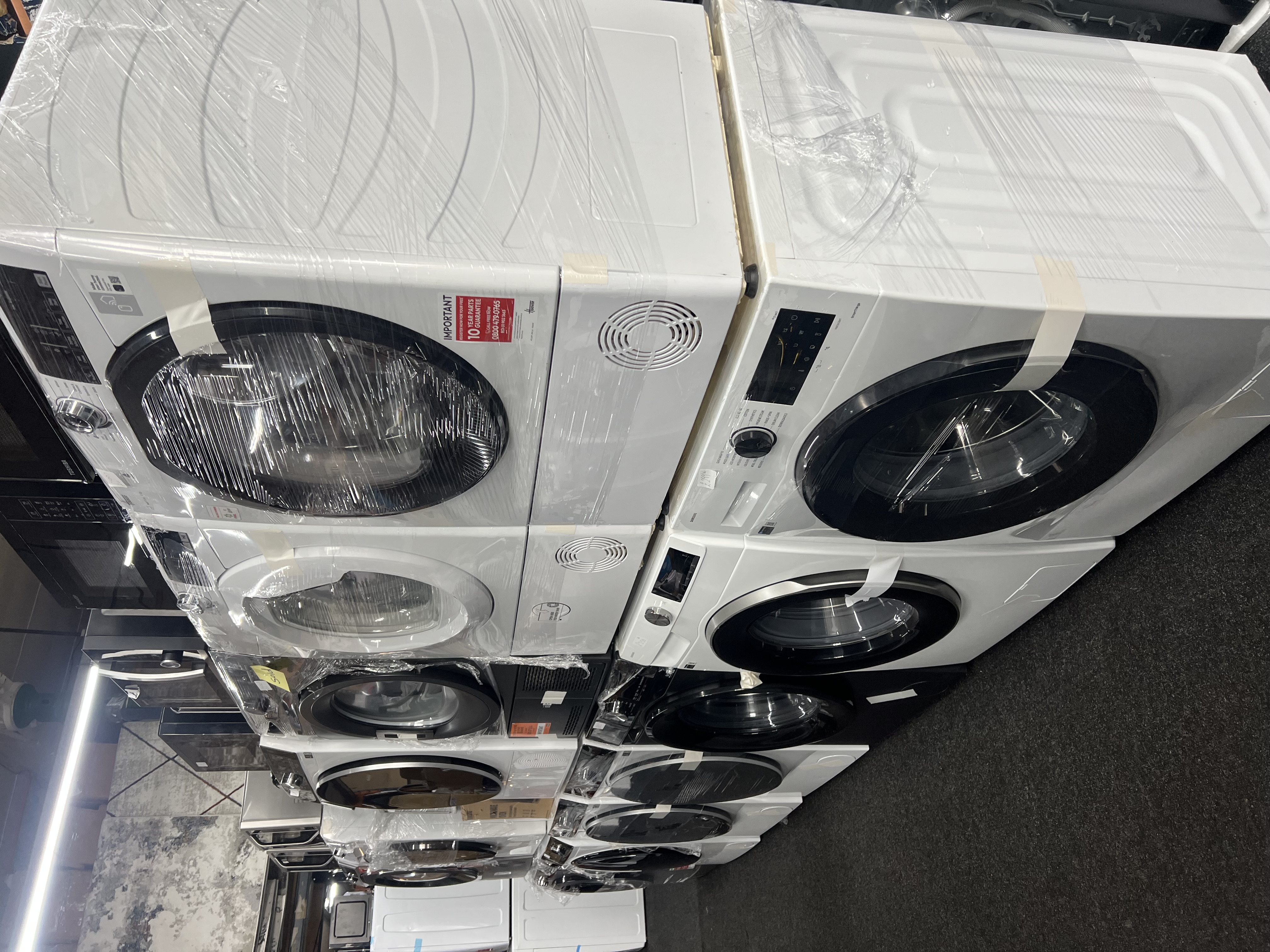 Laundry stock including washing machines and dryers in the warehouse
