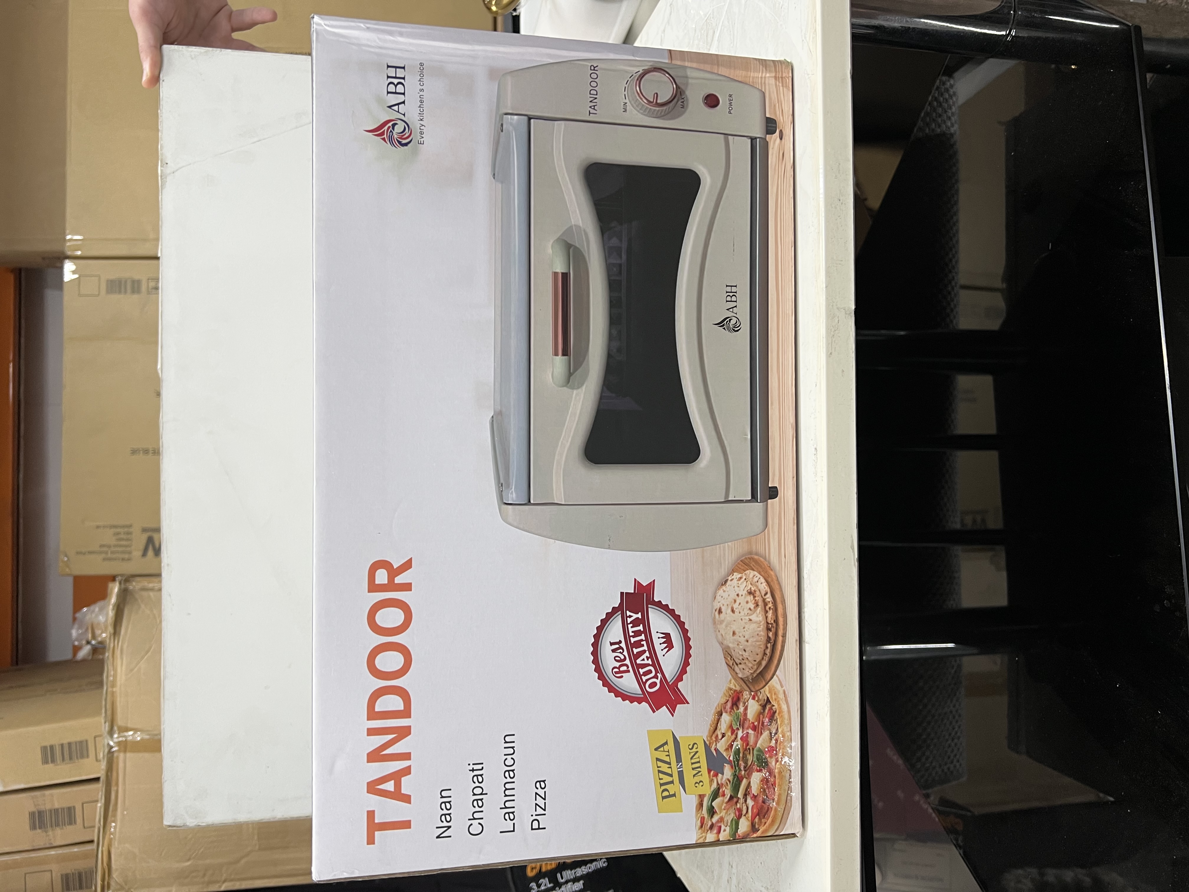 Cooking appliance stock including a tandoor oven box