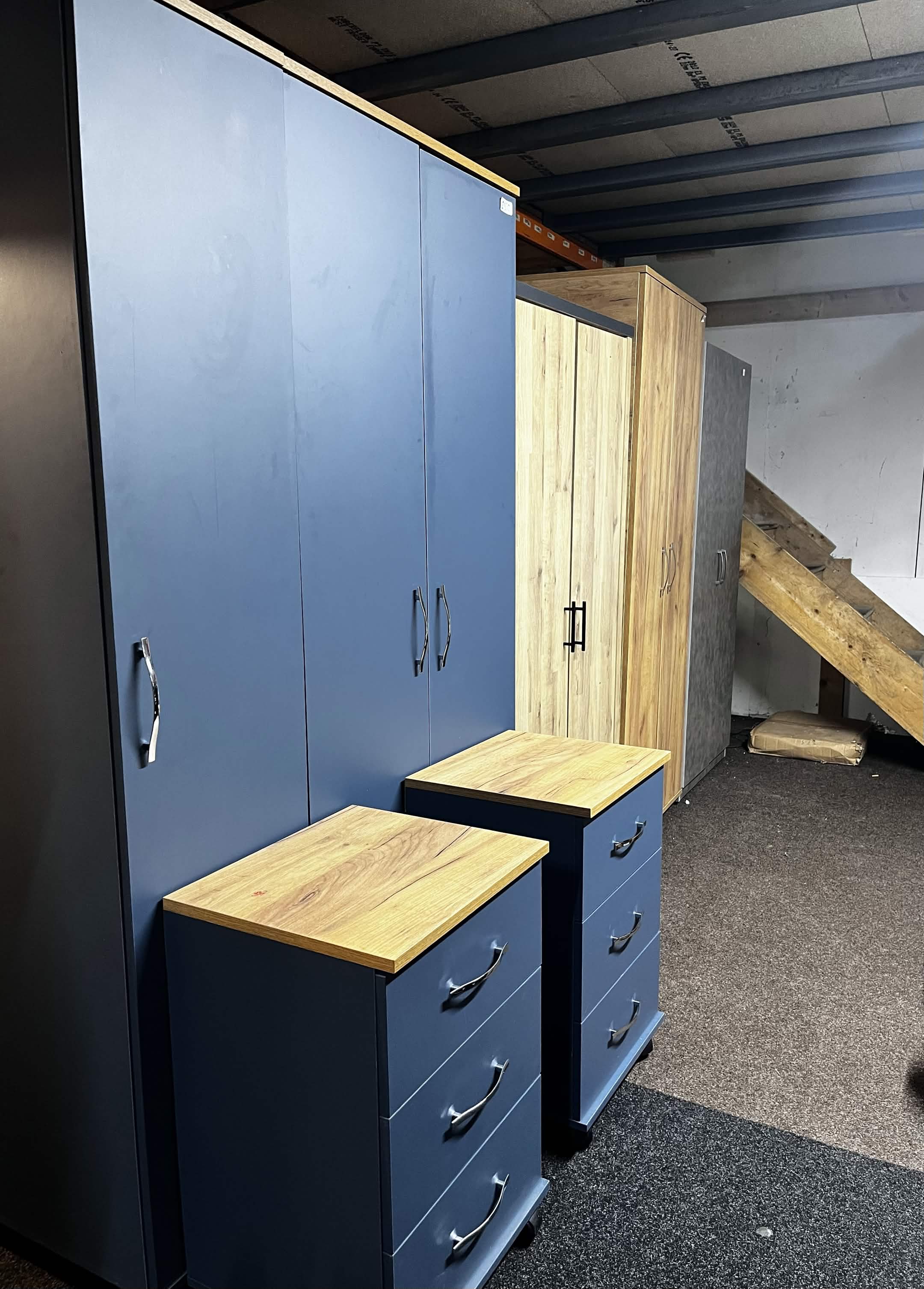 Wardrobes and drawers on display in the warehouse